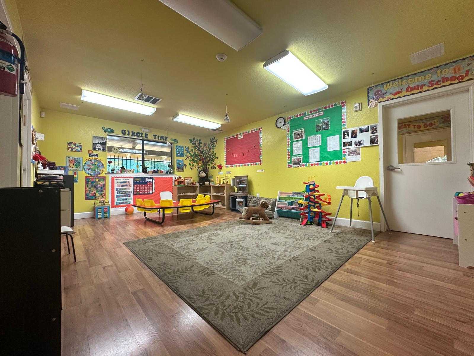 Bright and inviting preschool classroom with colorful decorations, learning materials, and toys. Designed for early childhood education and play.